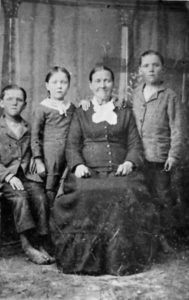 Ane Marie Madsen Johnson with her younger children, twins Jacob and Ephraim and daughter Agnes